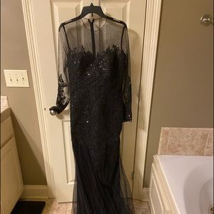 A black long Evening Gown with mermaid train by Hebeos.
